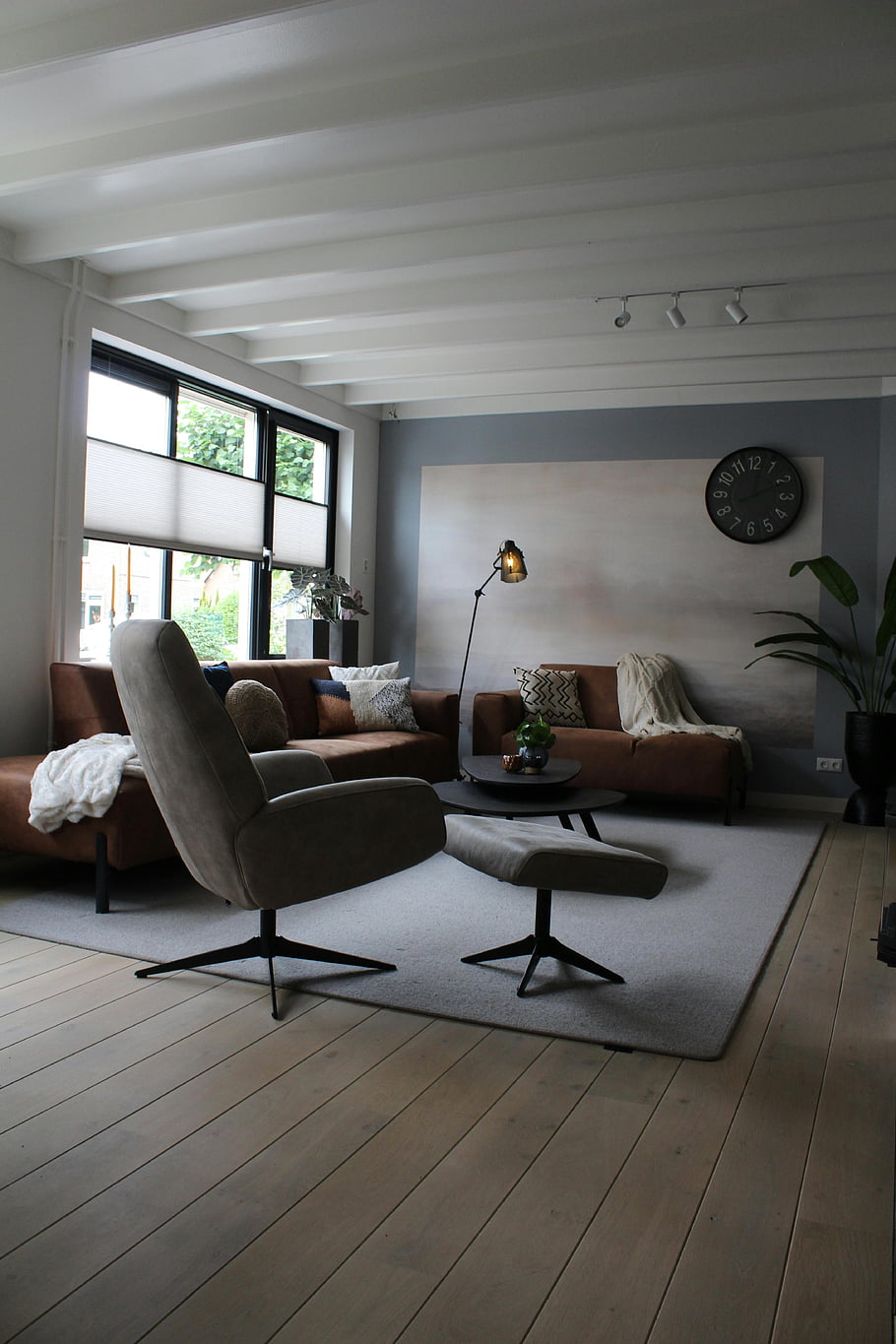 minimal interior design, living room, contemporary furniture, large windows, minimalist decor, cozy home, spacious room, modern living space, neutral color palette, wooden flooring, simple decor
