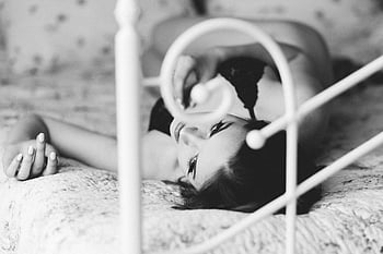 black and white portrait, woman lying on bed, elegance, beauty, black bra, monochrome photography, bed portrait, female beauty, black and white photography, elegant woman, bed scene