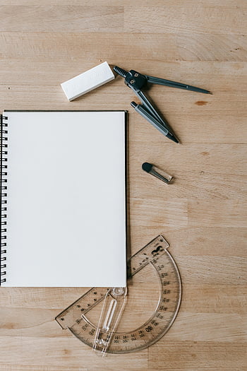 notepad, school supplies, notebook, compass, eraser, protractor, wooden desk, flat lay, stationery, study tools, educational items