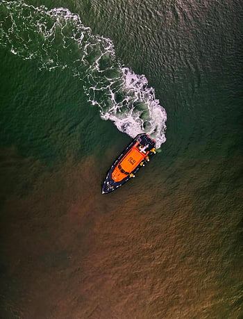 orange and black boat, ocean, drone shot, lifeboat, Exmouth, England, navigating, aerial view, watercraft, maritime, rescue vessel