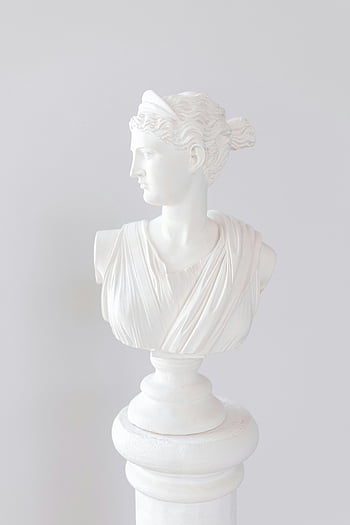 white bust, classical sculpture, white marble, woman bust, studio photography, white background, pedestal, art statue, female figure, ancient style, white drapery