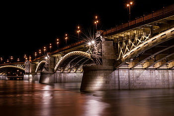 Margaret Bridge, Budapest, nighttime view, Danube River, calm water, bridge reflection, city lights, urban landscape, architectural photography, night photography, Hungary