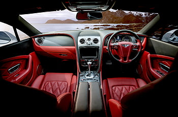 Červené vnitřní auto, luxusní sportovní auto, Interiér červené kůže, horské pozadí, Design interiéru auta, Interiér sportovního automobilu, červená autosedačka, palubní desku, volant auta, Konzola pro automobily, Interiérová fotografie automobilu