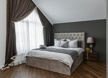 modern bedroom, plush bed, elegant curtains, cozy decor, contemporary decor, stylish bedroom, bed pillows, wooden floor, bedside lamp, gray walls, large window