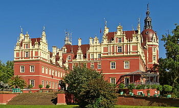 Muskau Castle, UNESCO World Heritage, Germany, clear blue sky, red mansion, historical site, European architecture, castle view, outdoor scene, travel destination, landmark