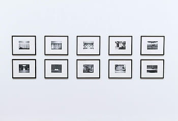 frames on white background, black and white framed photographs, modern interior, wall display, simple and elegant, black frames, white background, interior design, photo gallery, minimalist decor, art collection
