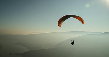 paragliding, Lake Annecy, mountain views, thrill, parachute, outdoor adventure, aerial view, scenic landscape, extreme sports, flying, nature