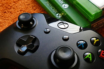 Xbox One Controller, Xbox One Cases, Xbox controller, game cases, orange background, close-up, gaming accessories, video games, console gaming, entertainment, technology