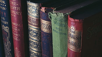 vintage books, hardcover books, ornate book jackets, assorted titles, close-up books, book spines, literary collection, antique books, bookshelf display, classic literature, book covers