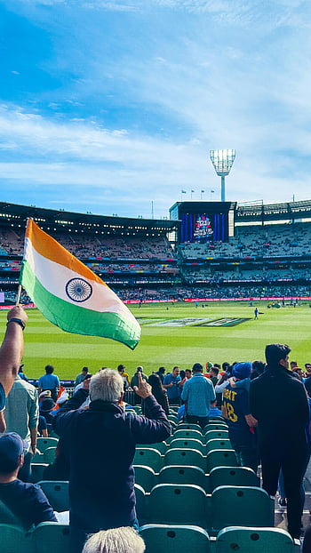 Indian flag, Melbourne Cricket Ground, excited fans, cricket match, stadium, sports event, crowd, cheering, India supporters, sports fans, cricket fans