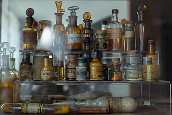 vintage apothecary bottles, historical pharmaceutical storage, old bottles, antique containers, vintage pharmacy, apothecary collection, pharmaceutical history, vintage medicine bottles, antique glassware, historical apothecary, vintage storage containers
