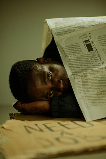homeless man, poverty, unemployment, cardboard, emotive image, seeking help, newspaper, need job, lying down, social issues, street life