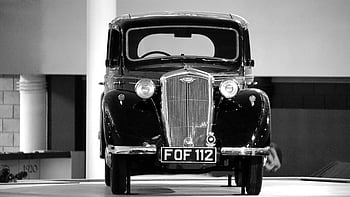 black vintage car, classic car, FOF 112, black and white, indoor photo, front view, vintage automobile, classic automobile, black car, vintage vehicle, classic vehicle