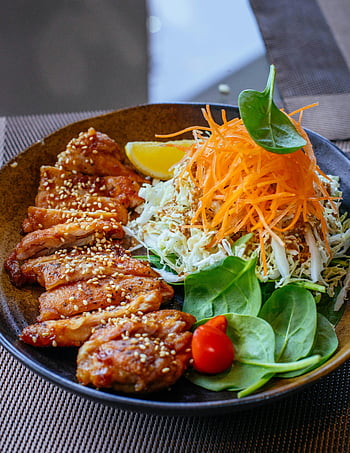 Asian salad, grilled chicken, healthy eating, vibrant dish, sesame seeds, fresh vegetables, close-up photo, tasty cuisine, salad bowl, healthy meal, Asian cuisine