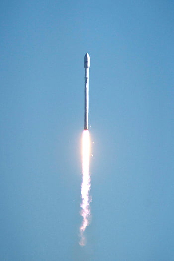 Falcon 9, rocket launch, clear blue sky, space exploration, propulsion, aerospace engineering, spacex, vertical ascent, space mission, technology innovation, orbital launch