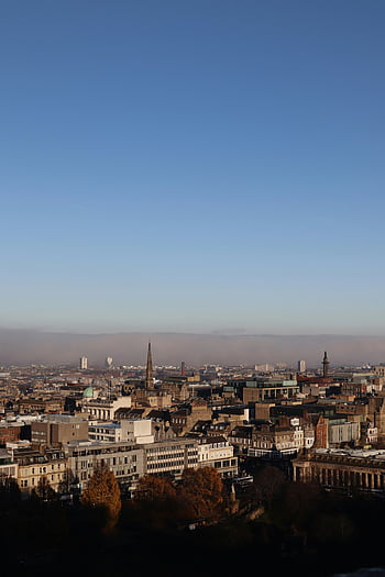 aerial photography, city buildings, blue sky, urban cityscape, scenic view, clear sky, city skyline, architectural landmarks, urban landscape, city panorama, high-angle view