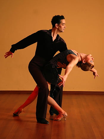 ballroom dance, man and woman dancing, elegant performance, passion, skill, grace, dance couple, dance pose, dance performance, dance partners, dance studio