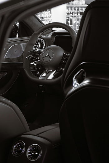 Mercedes-Benz interior, luxury car interior, sleek design, advanced features, elegant interior, car dashboard, steering wheel, car seats, high-end vehicle, automotive luxury, car cabin