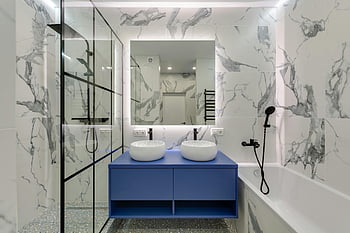 modern bathroom, marble walls, dual sinks, glass shower, bathtub, interior design, bathroom design, contemporary bathroom, luxury bathroom, bathroom fixtures, blue vanity