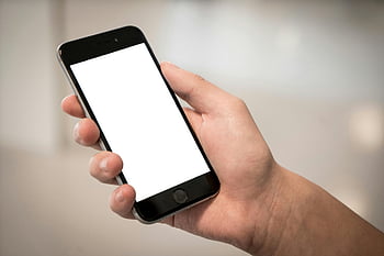 selective focus, person holding iPhone, white screen, smartphone mockup, blank screen, modern smartphone, hand holding phone, design mockups, iPhone display, white display, selective focus photography