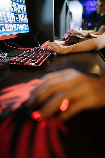 gamer, competitive gaming, RGB peripherals, mechanical keyboard, selective focus, PC gaming, vibrant lights, gaming session, hand on keyboard, gaming setup, esports