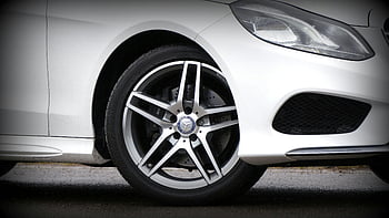White Mercedes-Benz, 5-spoke wheel, luxury car wheel, detailed car design, car headlight, Mercedes-Benz tire, car wheel design, luxury vehicle wheel, car wheel close-up, car tire, car wheel details