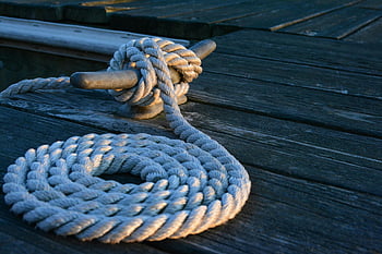 nautical knot, weathered wooden dock, sunset, rope, close-up, sturdy knot, dock, marine, outdoor, maritime, rope knot