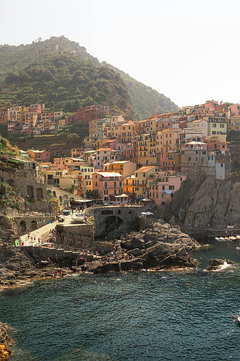 Cinque Terre, colorful clifftop village, vibrant architecture, coastal views, Italy, scenic view, clifftop town, seaside village, Mediterranean coast, travel destination, picturesque landscape