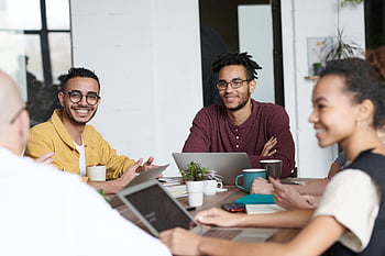 people using laptops, professionals collaborating, modern office setting, group meeting, office collaboration, team work, business meeting, office environment, workplace collaboration, professional team, office workspace