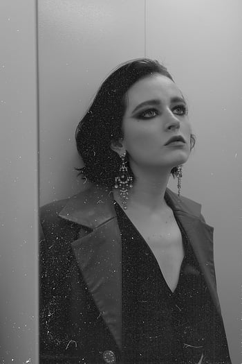 dreamy woman, smokey eyes, festive clothes, moody portrait, black and white, stylish woman, expressive eyes, earrings, fashion photography, portrait photography, black and white photography