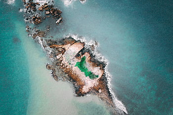 rocky islet, barren islet, ocean, turquoise sea, aerial shot, serene islet, rocky island, ocean view, natural landscape, coastal scenery, turquoise water