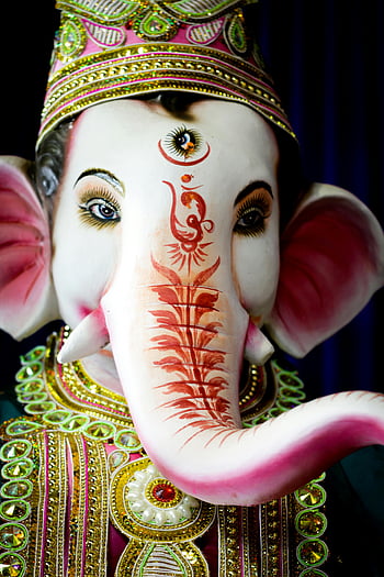 Ganesh statue, close-up photo, Hindu god, decorated idol, Patna, vibrant colors, festivity, devotion, elephant god, religious art, cultural symbol