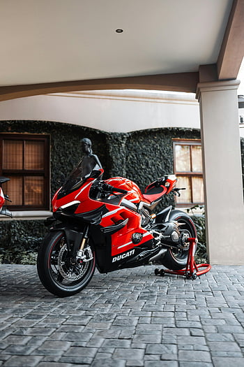 Ducati Panigale V4, red motorcycle, parked motorcycle, urban environment, outdoor motorcycle, motorcycle stand, Ducati, Panigale V4, red Ducati, urban motorcycle, outdoor Ducati