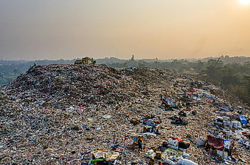 landfill, aerial shot, garbage piles, waste management, challenges, bird's eye view, dawn, environmental issues, pollution, recycling, sustainability