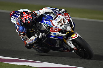 motorcycle racing, night lights, international circuit, high-speed action, sport bike, rider, Suzuki, racing helmet, racing suit, track, daytime racing