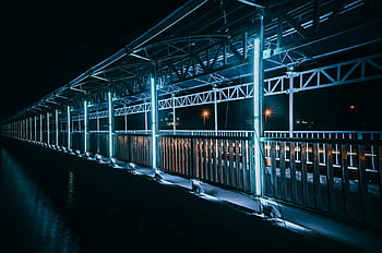 White Led Light, illuminated walkway, night view, modern design, vibrant lights, geometric designs, urban lighting, architectural photography, nighttime scene, cityscape, structural elements