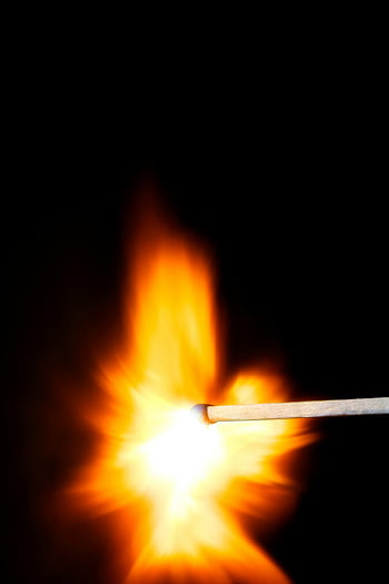 lighted match stick, vivid flame, dark background, close-up, matchstick igniting, bright fire, ignition moment, fiery glow, intense light, burning match, high contrast