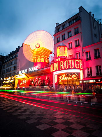 Moulin Rouge, neon signages, dinner theater, vibrant neon lights, iconic Moulin Rouge, illuminated at night, Paris nightlife, Paris attractions, Moulin Rouge show, neon theater, Paris evening entertainment