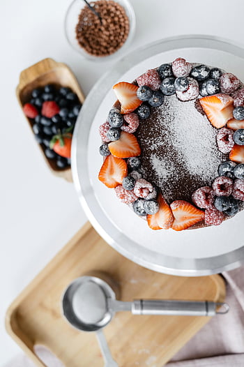 homemade cake, decorated cake, berry cake, fresh fruits, powdered sugar, cake stand, strawberries, blueberries, raspberries, dessert, indulgence