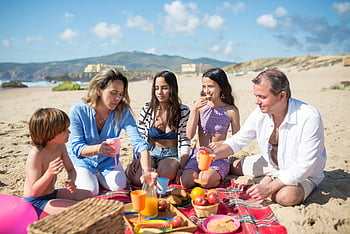 beach picnic, family picnic, sandy beach, Portugal beach, fruits and drinks, bright sky, family enjoying, beach activities, outdoor picnic, beach family, beach fruits