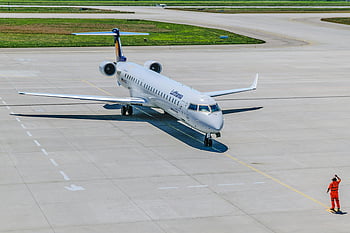 Lufthansa airplane, airport staff, directing traffic, runway, airport, airplane, traffic control, aviation, aircraft, airport personnel, plane