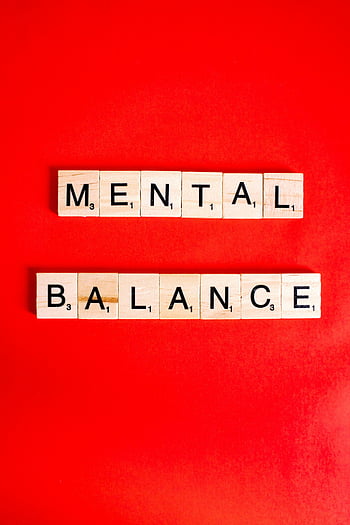 mental balance, wooden letter blocks, red background, mental health, scrabble tiles, bold red, health awareness, mental wellness, balance concept, letter tiles, red backdrop