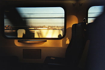 train seats, moving train, sunlight, interior seats, train window, train interior, train travel, train journey, travel photography, train photography, train interior design
