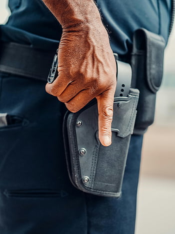 policeman, firearms, holstered firearm, police officer, law enforcement, readiness, close-up view, hand, uniform, duty belt, holster