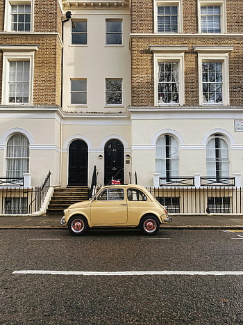 yellow car, vintage car, Georgian architecture, central London, parked car, concrete building, charming car, vintage yellow car, street parking, urban scene, classic car