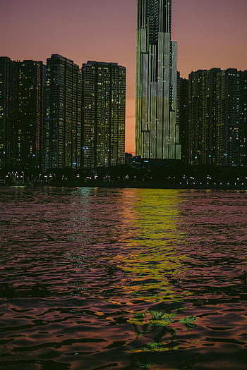 Ho Chi Minh, Saigon River, Landmark 81, twilight, city lights, river reflection, urban skyline, evening view, Vietnam, cityscape, waterfront
