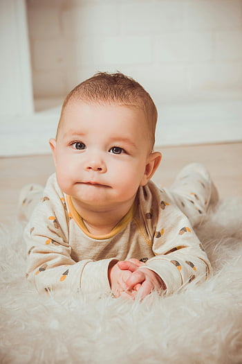 baby, lying on tummy, soft rug, innocence, cuteness, indoors, charming baby, baby photography, indoor baby photos, baby on rug, baby innocence