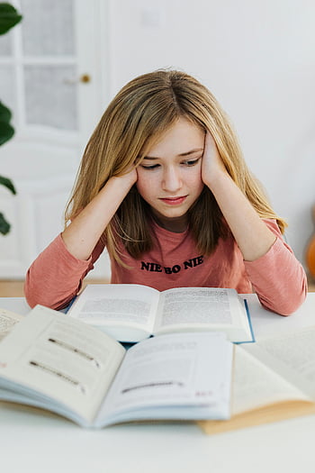 girl reading, teenage girl, studying at home, open textbooks, concentration, education, focused student, home study, academic learning, young learner, book reading