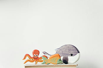 wooden toy figures, sea creature toys, whale, fish, octopus, wooden toys, charming collection, white background, wooden sea creatures, toy collection, wooden sea animal toys