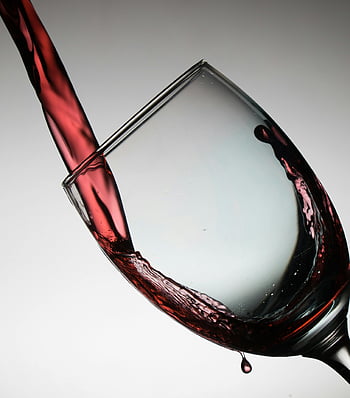 wine glass, red wine, pouring wine, dramatic capture, elegance, flow, tilted glass, wine pouring, wine photography, wine art, wine moment
